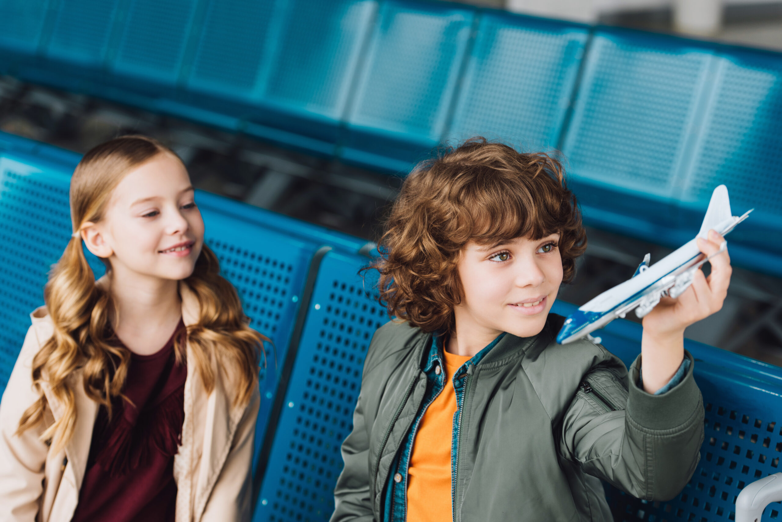 children at San Diego international airport waiting for flight after a ride with City Captain Transpiration